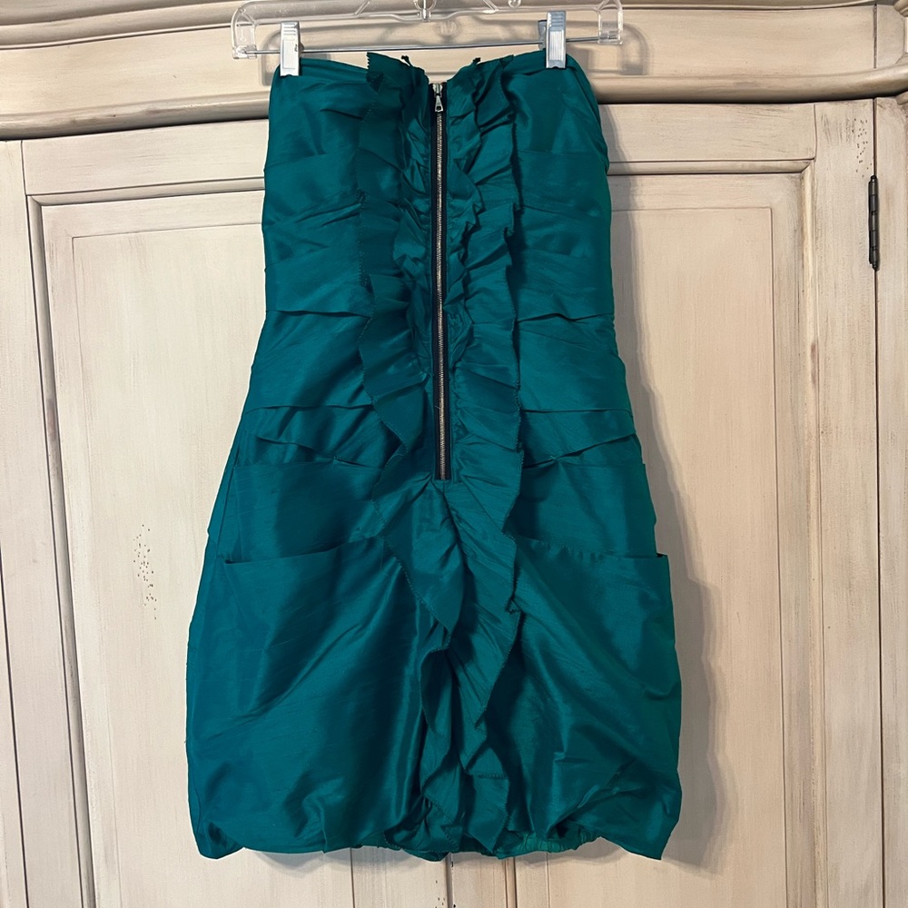 Green strapless cocktail dress.